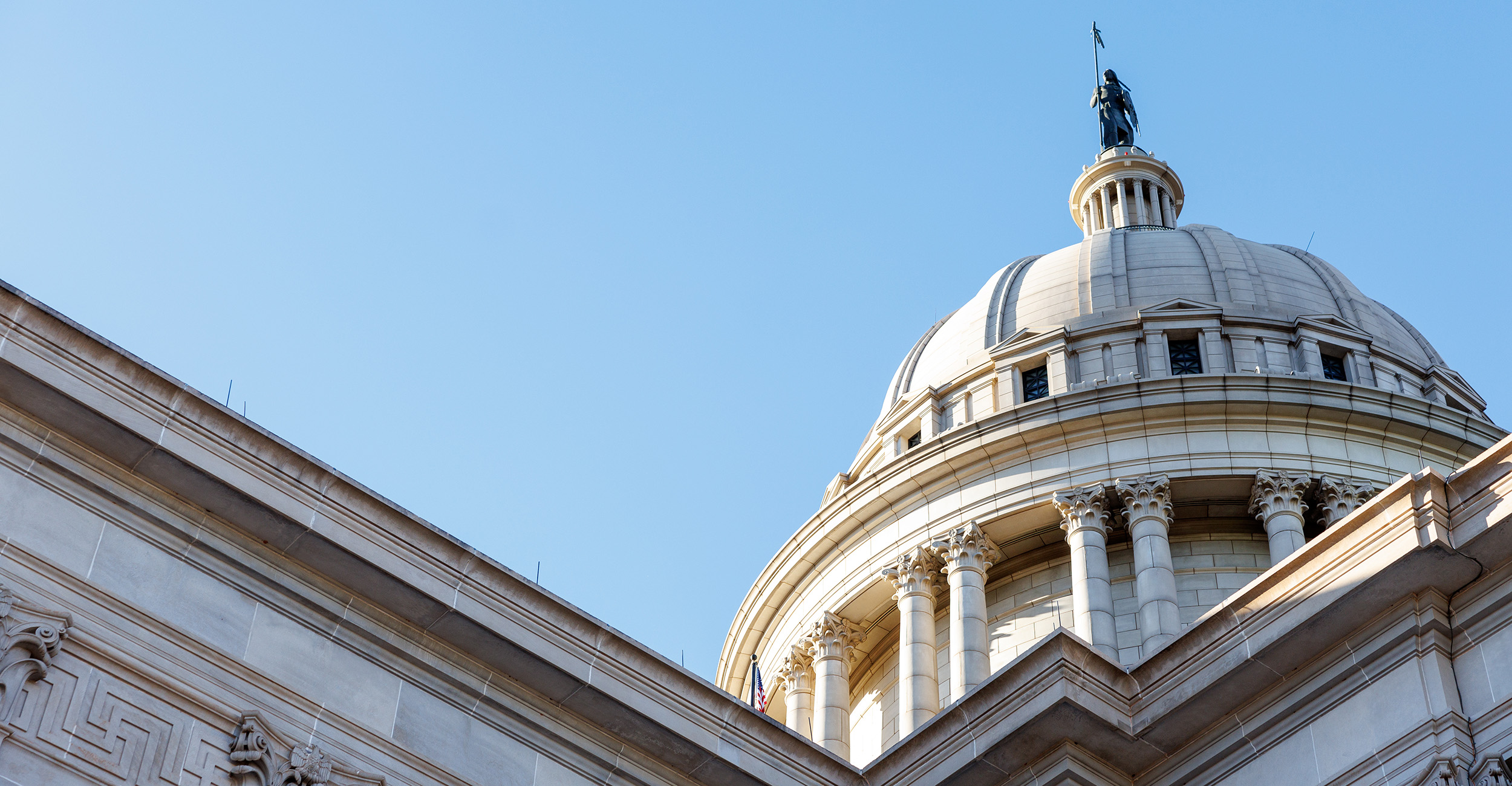 the Oklahoma State Capitol Dome with a blue sky background