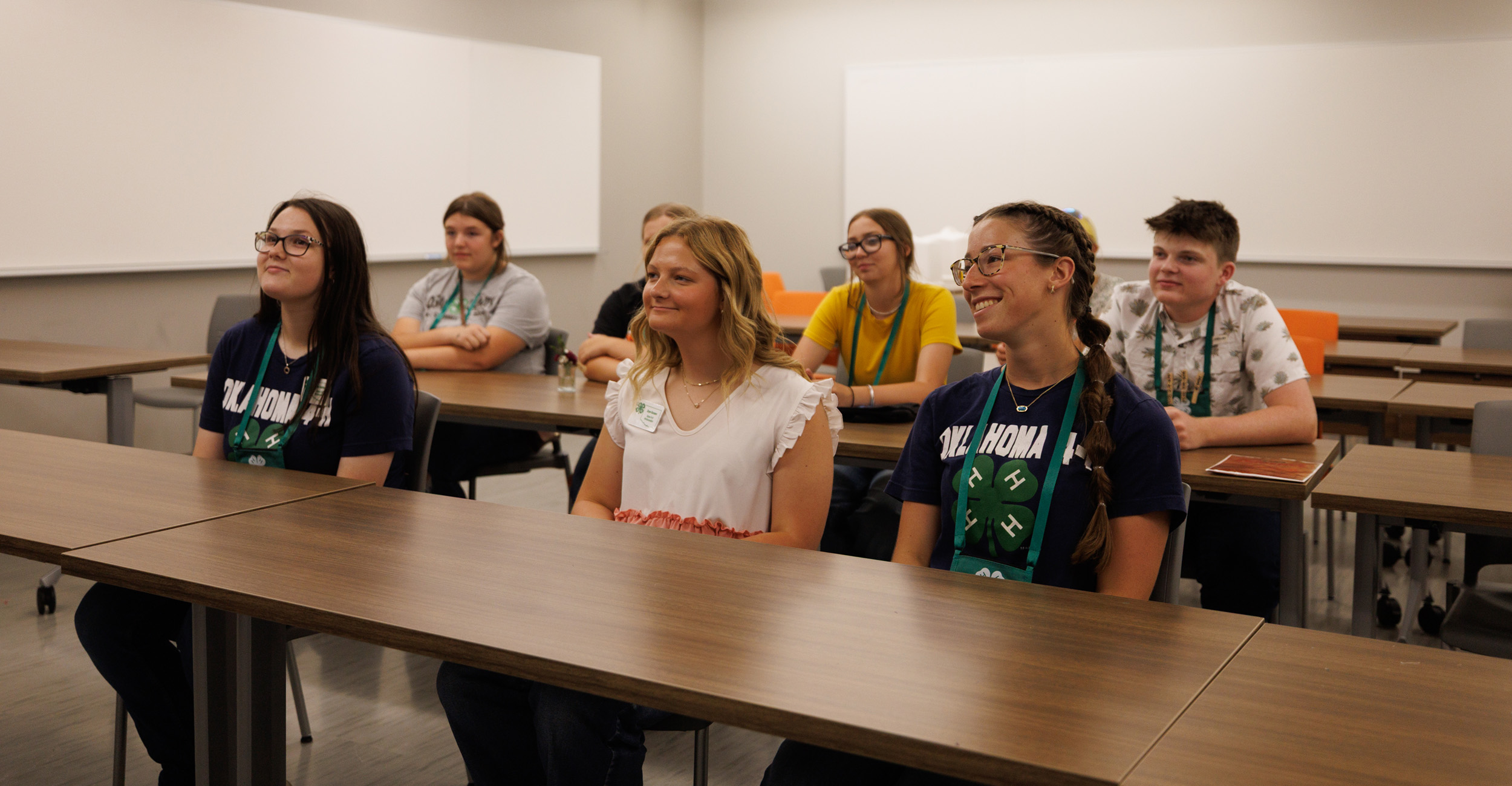 A group of Oklahoma 4-H'ers sitting in a classroom setting.