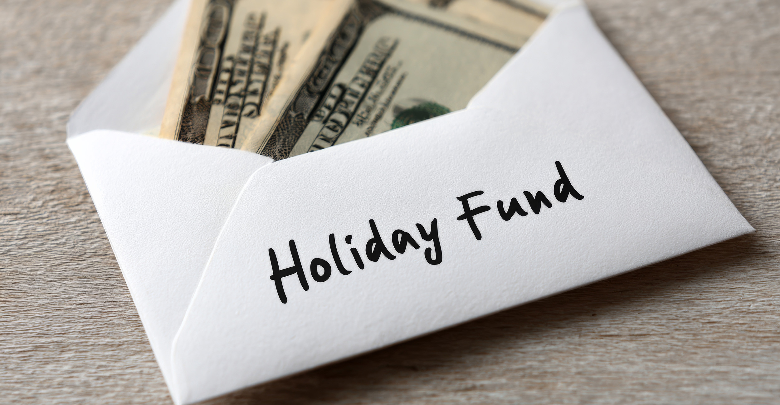 White envelope on a table containing cash.