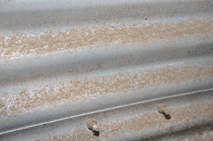 Residual grain dust on the inside of a bin.