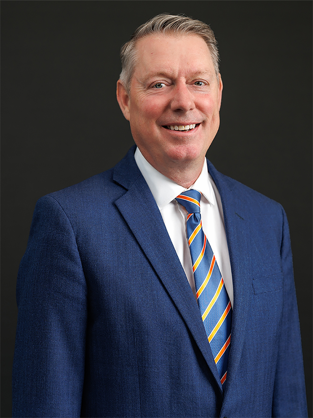 Dr. Jayson Lusk dean of osu agriculture in a suit with tie.