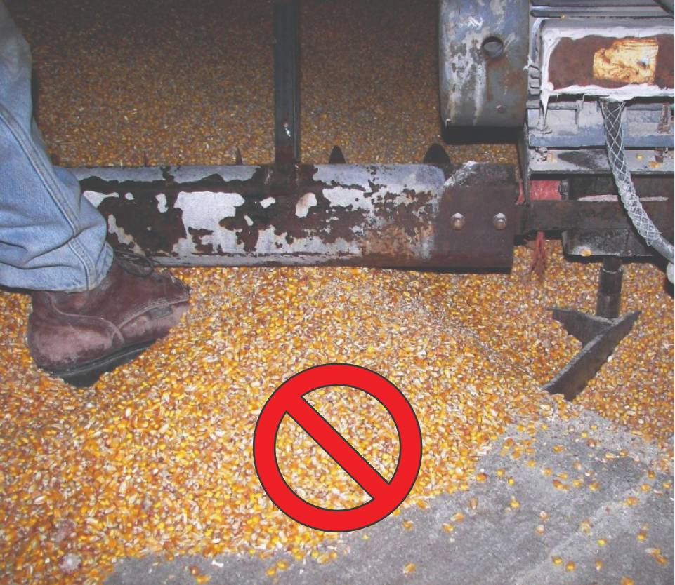 Moving grain with foot in front of sweep auger