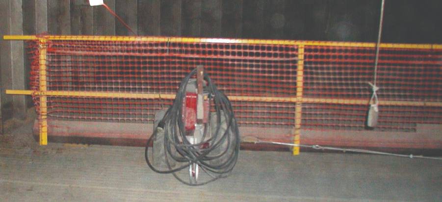Fencing to protect worker from sweep auger