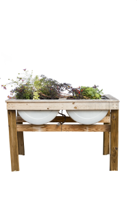Small garden in metal tub built into a wood table