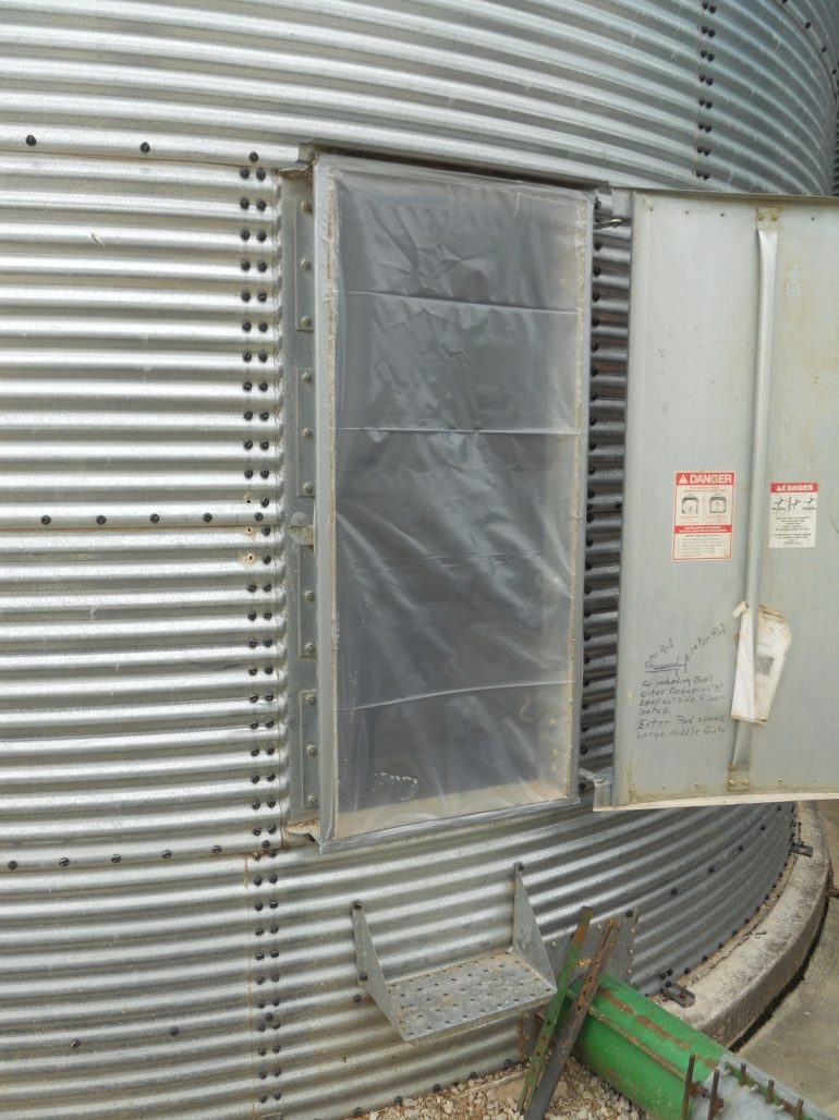 Access door sealed with polyethylene film and duct tape