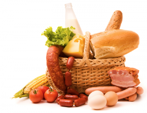 Meat, bread, cheese and vegetables in and around a basket
