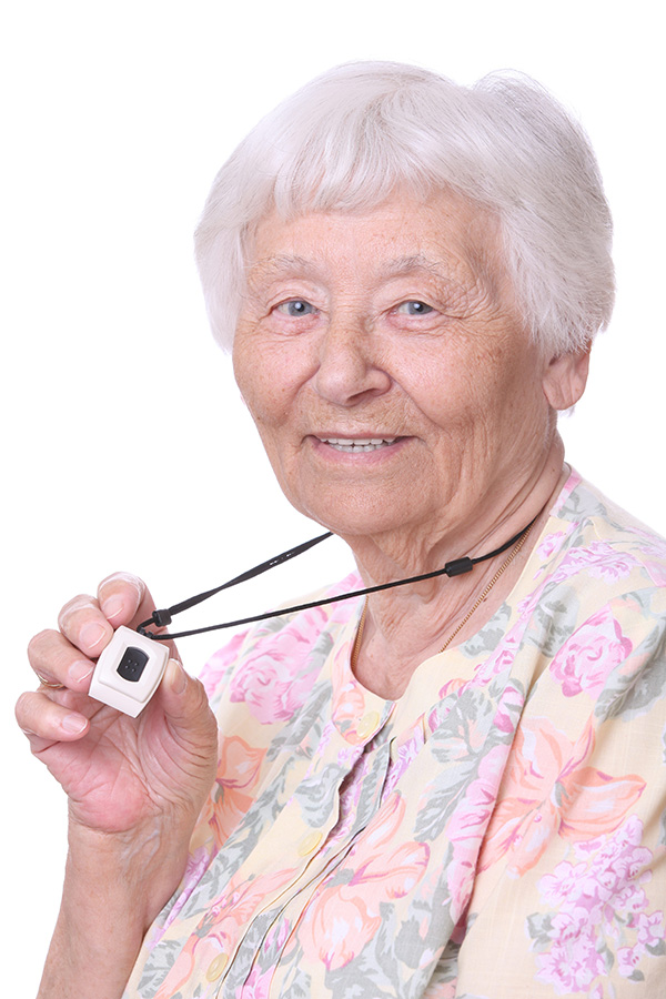 Old woman holding her life-saving device around her neck.