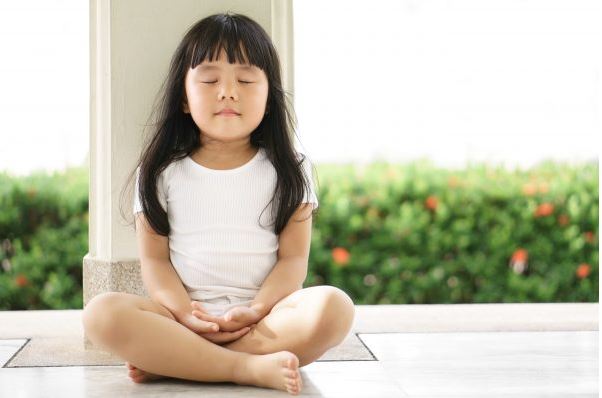 A child meditating.