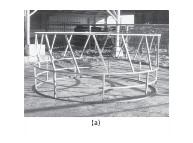 A round metal skeleton bale feeders for cattle.