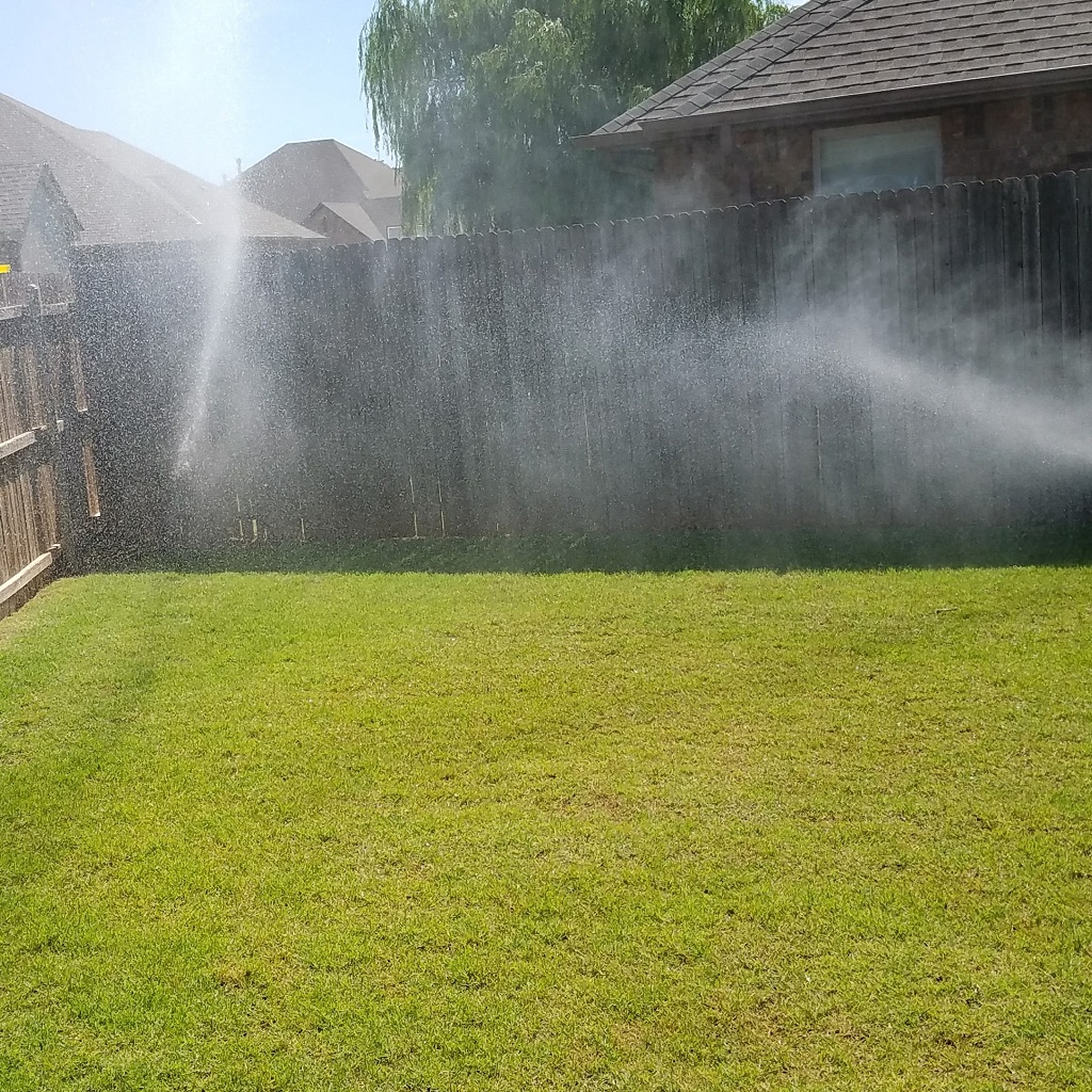 Healthy green is being watered by a high pressure irrigation system.