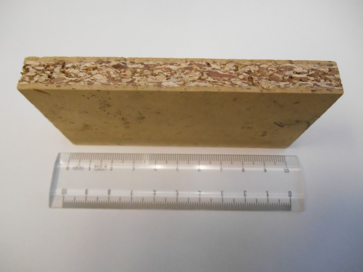 Small panel of wood with a ruler. 