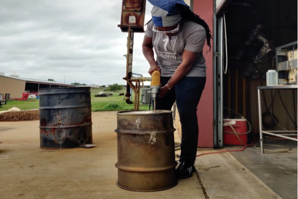Drilling a hole in the lid for thermocouple.