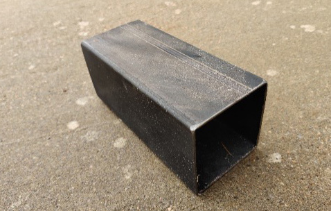 Metal box used as a stand for the small barrel (18 cm X 7.5 cm X 7.5 cm).