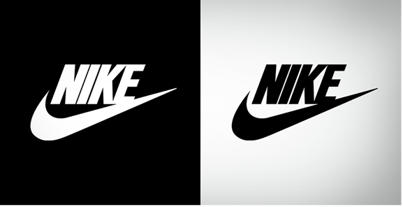 A white Nike logo on a black background next to A black Nike logo on a white background.