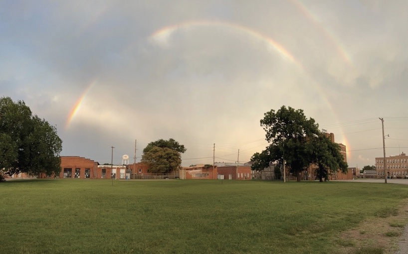 A light sky with a rainbow.