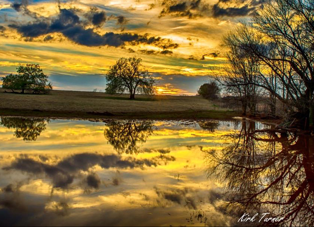 Beautiful yellow and blue sunset that reflects off the water. Beautiful yellow and blue sunset that reflects off the water.