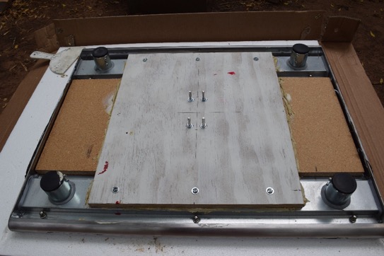 White color plywood support board glued and screwed to the underside of tabletop.