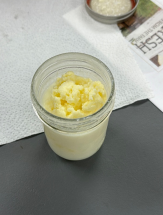 A top view of a jar of homemade butter made by the participants in the class.