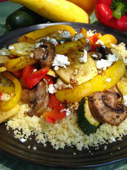 Couscous with roasted summer vegetables on a plate. 