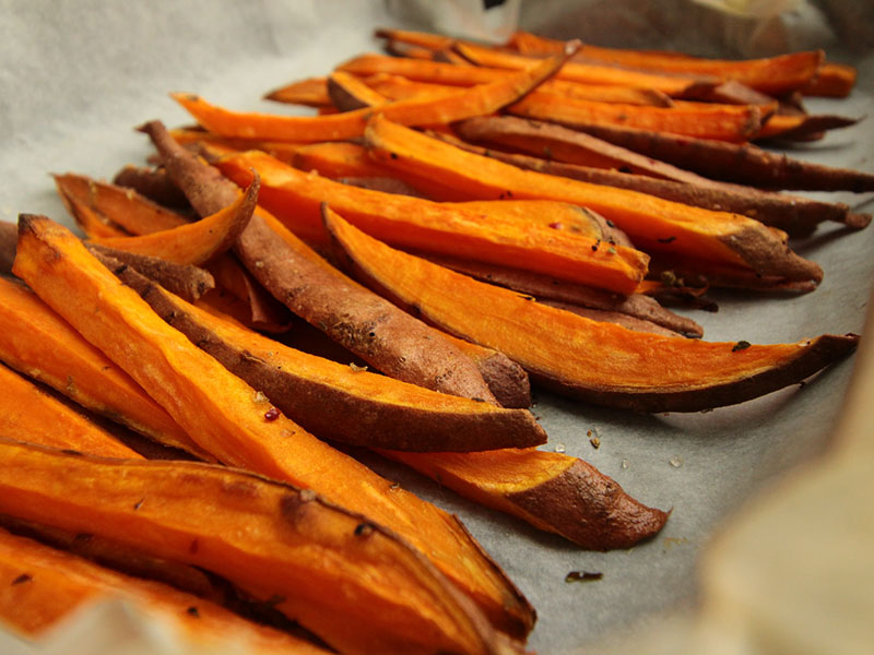 A tray of sliced sweet potatoes.