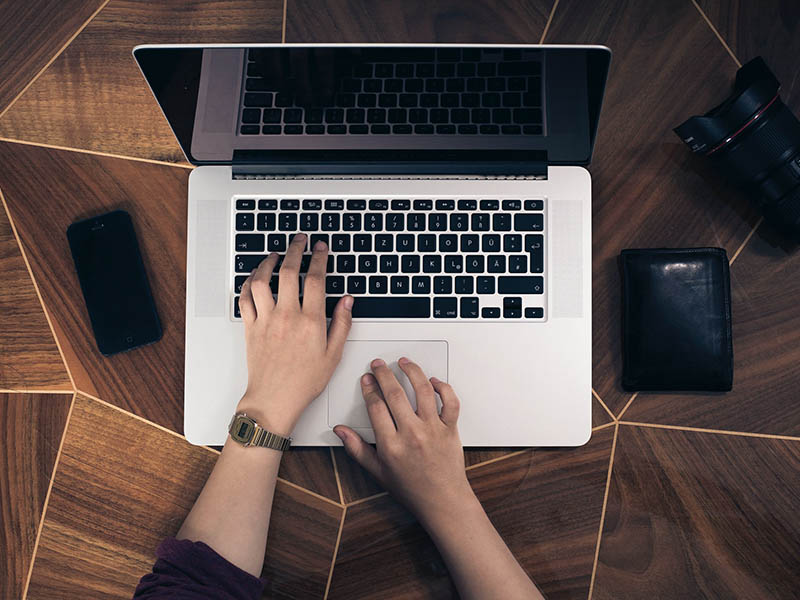 A person typing on a computer.