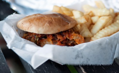 A burger and fries being served in a basket. A burger and fries being served in a basket.