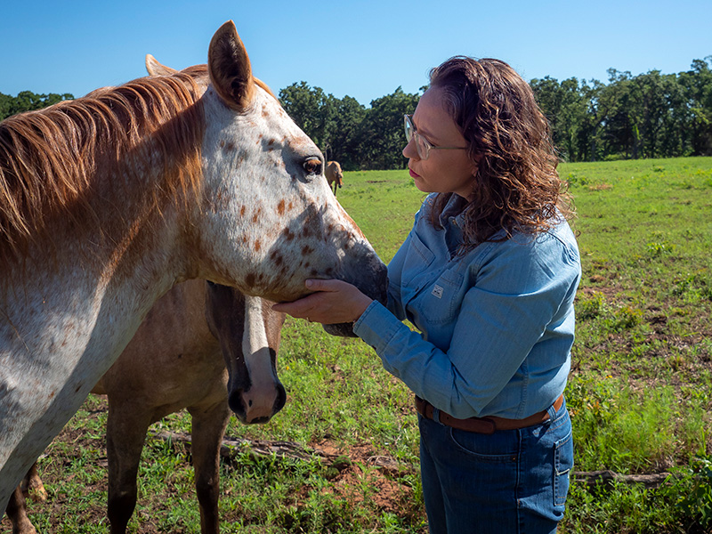 Rosslyn Biggs, DVM caring for a horse.